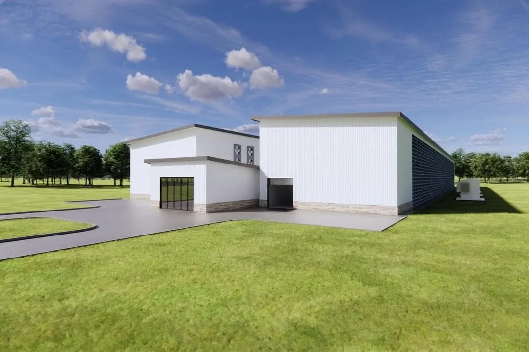 Architectural rendering of an AAIM data center building, showing the entrance and a louvered air-intake wall
